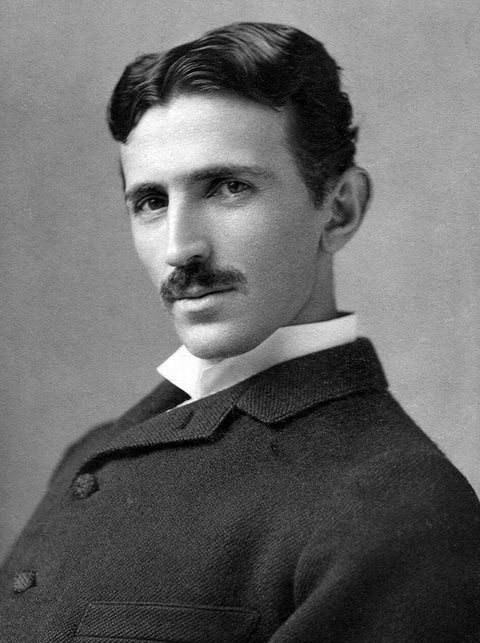 Black-and-white photograph of a man of about 34 with a mustache, a high white collar and a dark jacket.