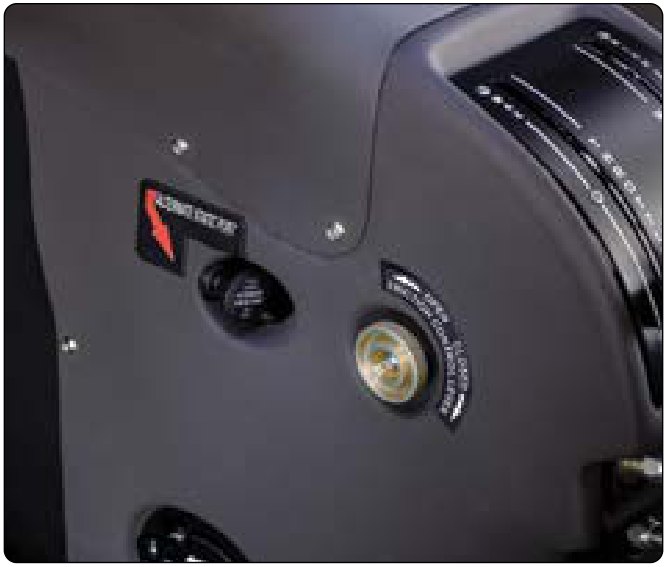 A dark instrument panel with a round brass alternate static source knob and a placard around it.