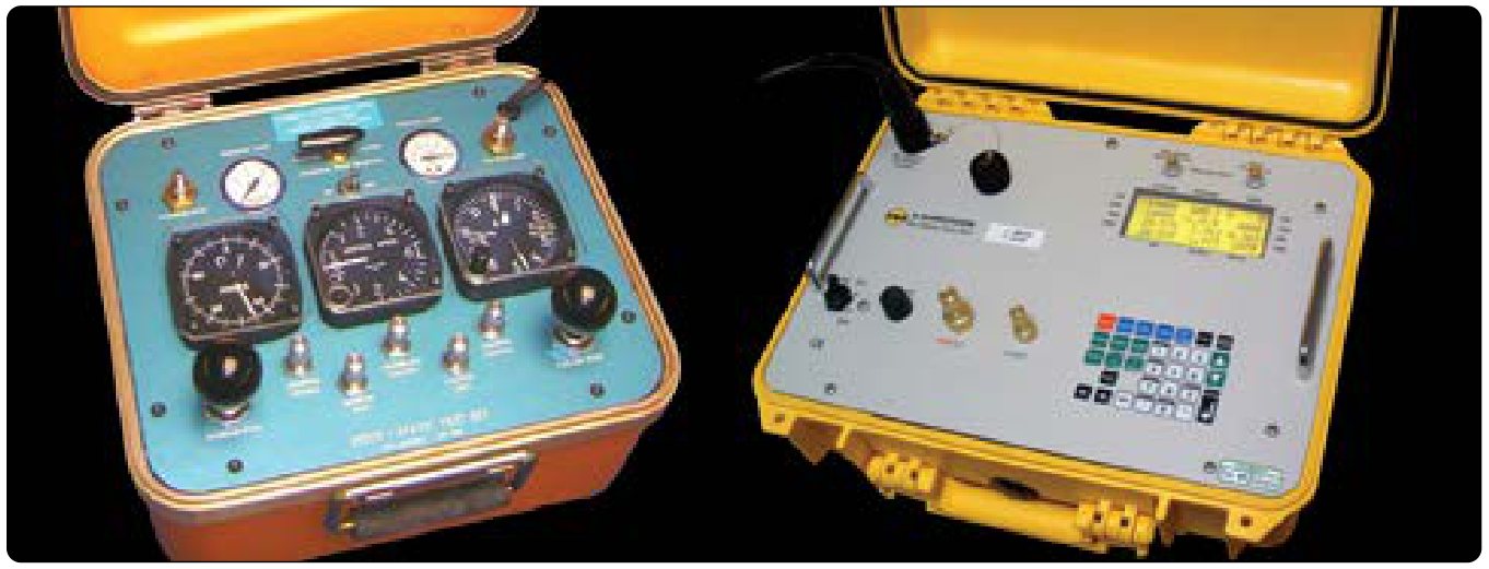 Two pitot-static test sets in open cases: an older one with three round gauges on a blue panel, and a digital one with a keypad and a display.